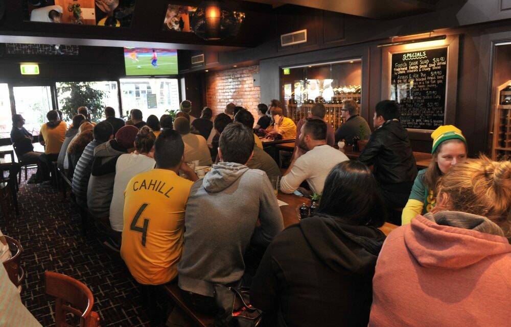 Canberra fans gathered at the Civic Pub on Saturday morning to watch the World Cup match between the Socceroos and Chile. Photo: Graham Tidy