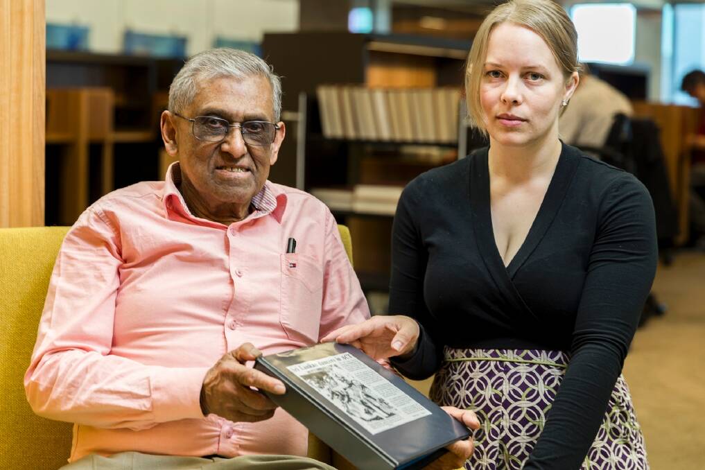 Retired journalist Don Abey with National Library of Australia reference librarian Sonja Barfoed holding a folder similar to the one stolen from his car in Chisholm. The stolen folder contained his memoirs. Photo: Sam Cooper