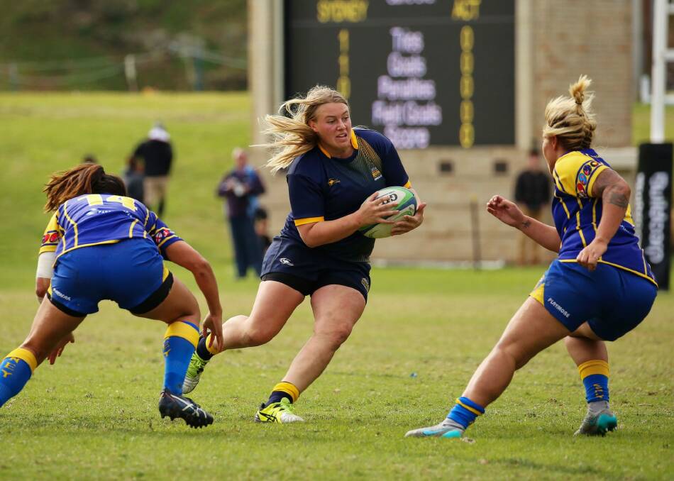 ACT's Tayla Stanford looks for a gap in Sydney's defence during Sunday's final. Photo: ARU