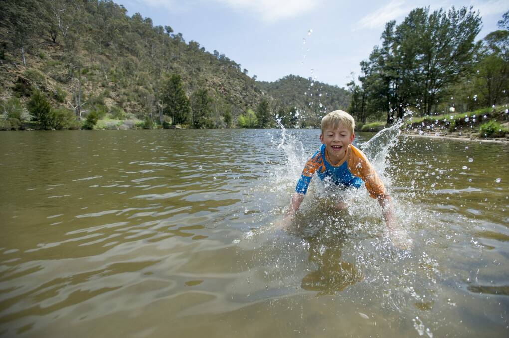 Harry Mackay, 8, makes a splash at the Kambah Pools. Photo: Jay Cronan
