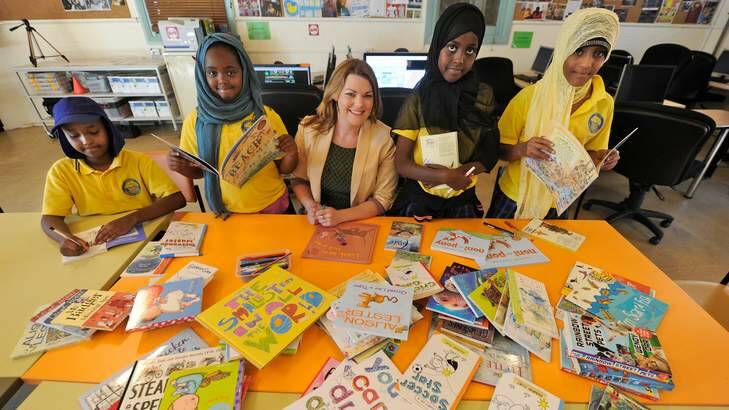 Reaching out ... Greens senator Sarah Hanson-Young launching a book club library service for kids in detention on Manus Island. Photo: Justin McManus