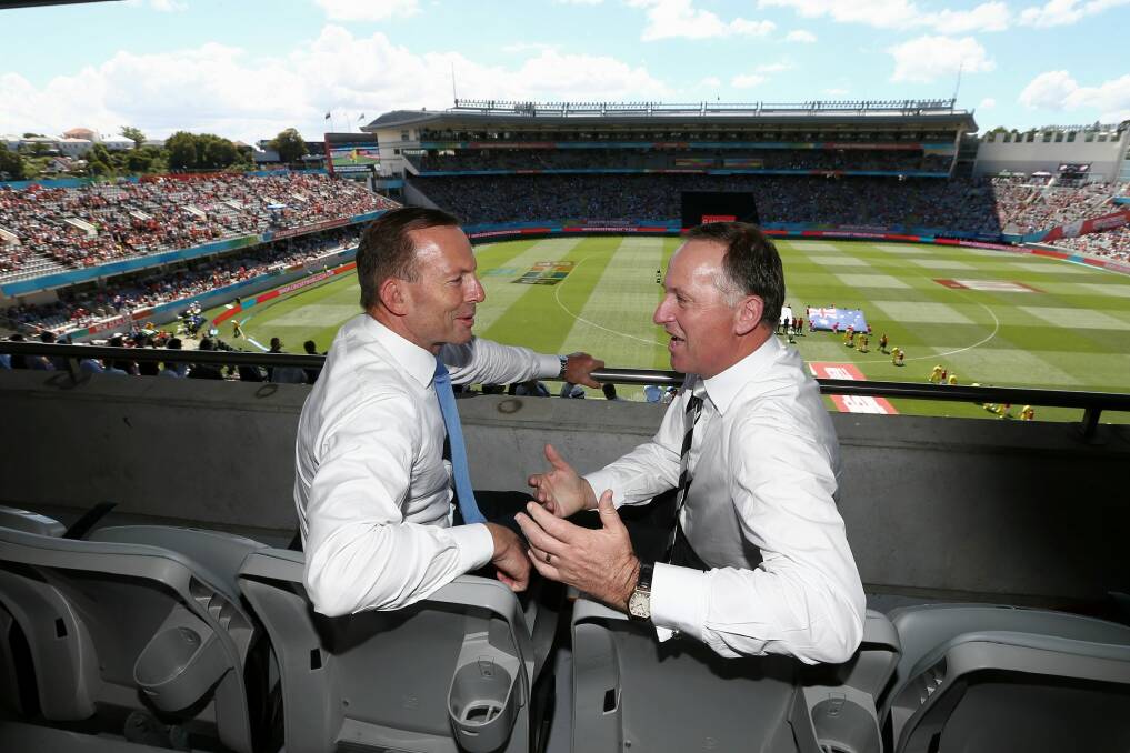 Friendly rivalry: Tony Abbott and John Key at the cricket in Auckland. Photo: Alex Ellinghausen