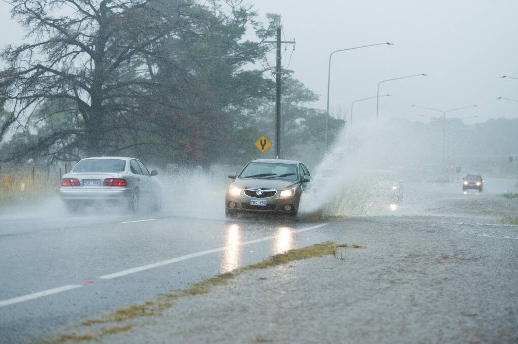 Heavy rain on Fairbairn Ave on Sunday.  Photo: Dion Georgopoulos