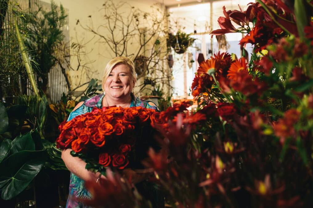 Manuka Flowers owner Sue Burden with some of the many roses she will sell for Valentine's Day. Photo: Rohan Thomson