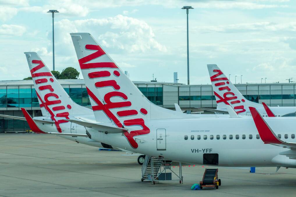 The ATSB has revealed a drone came close to colliding with a Virgin flight on approach to Brisbane Airport. Photo: Glenn Hunt
