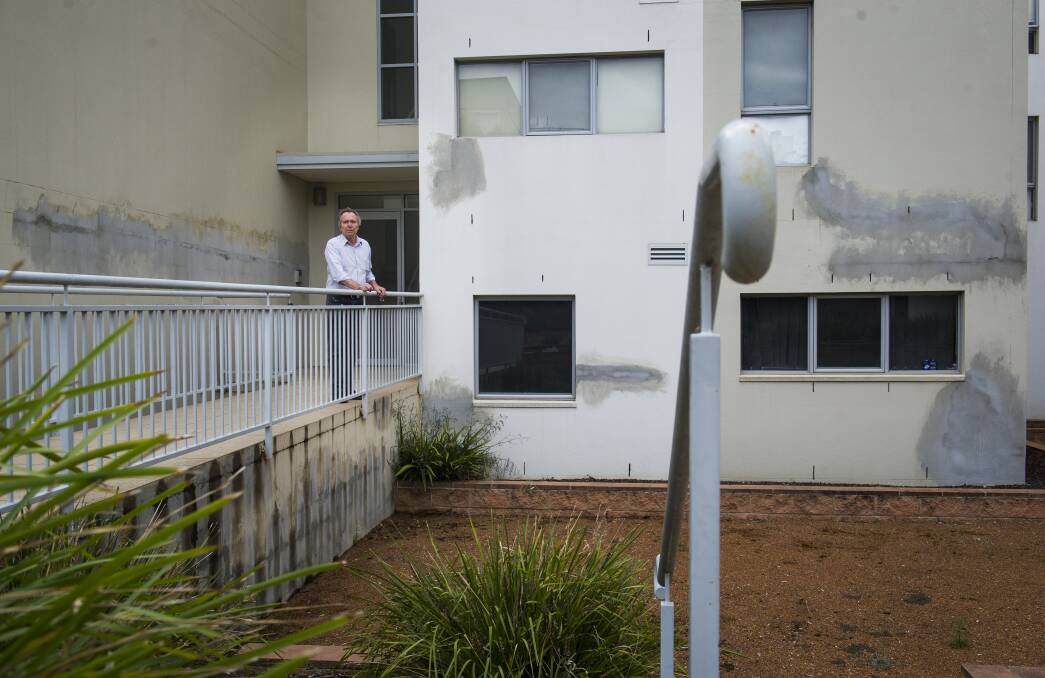 Elara apartment owners, including David Allen (pictured), are suing the builders' insurance scheme for alleged defects in their complex. Photo: Elesa Kurtz