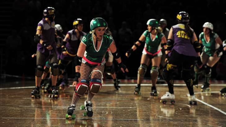 The Surly Griffins (green) and the BrindaBelters (purple) go head to head. Photo: Jay Cronan