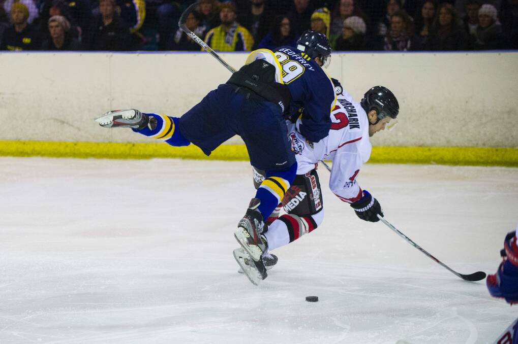 The Canberra Brave's Kelly Geoffrey attacks the puck in his team's opening game of the season against the Sydney Bears. Photo: Rohan Thomson