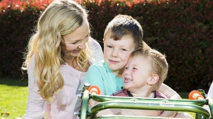 US surgery: Ollie Lanham, 2, with his mother Angela Patch and brother Elliot, 6. Photo: Matt Bedford