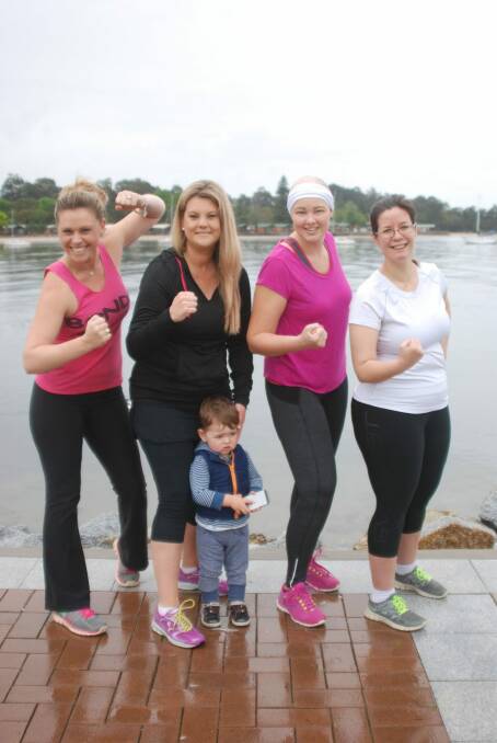 The Coastie Chicks competing in the Miss Muddy event in Canberra (l-r) Kasis Currall, Karen Van Der Stelt and son Lucas, Ashley Frigo and Marisol Dunham. Photo: act\megan.doherty