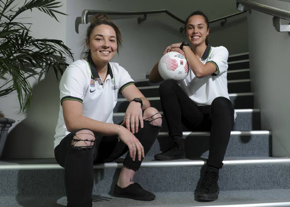 New signings for the Canberra United W-League squad (from left) Jenna McCormick and Emma Checker. Photo: Graham Tidy