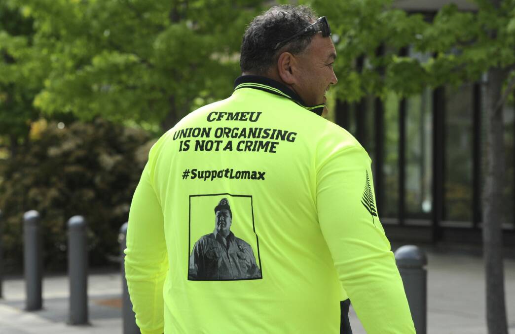 CFMEU organiser and former rugby league star John Lomax outside the ACT Magistrates Court in October, when a blackmail charge against him was dropped. Photo: Graham Tidy