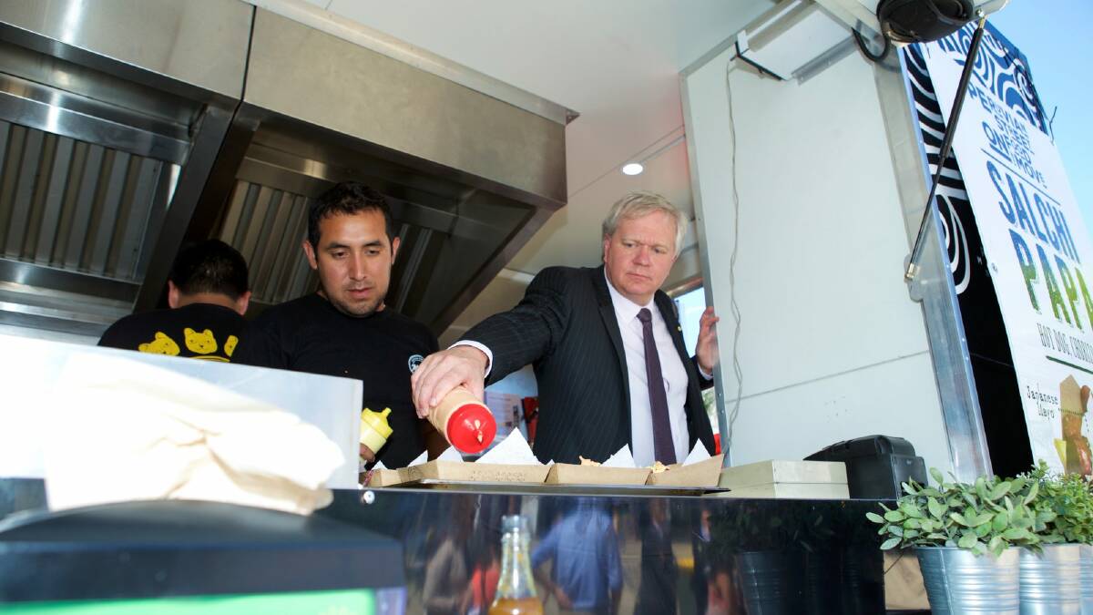 ANU Vice-Chancellor Brian Schmidt serves food at Mr Papa. Photo: Stuart Hay Australian National University