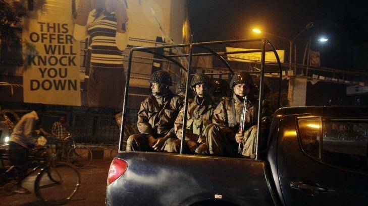 High alert: Security personnel from Border Guard Bangladesh patrol the city following the execution of Abdul Quader Mollah. Photo: AP