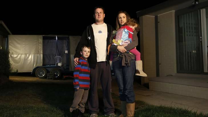 Justin and Erin Thompson and their children, Dan, 5, and Sarah, 3, were forced to leave their home after a builder's bungle. Photo: Jeffrey Chan
