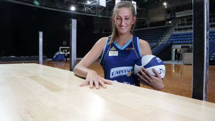 Canberra Capitals player Carley Mijovic checks out the new moveable floor at the AIS Arena. Photo: Jeffrey Chan