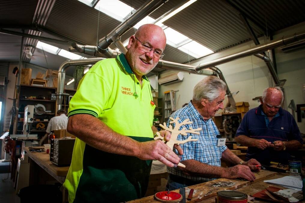 Belconnen Community Men's Shed manager, Gordon Cooper with members as residents in Page earn the closest to the national median income in the ACT. Photo: Elesa Kurtz