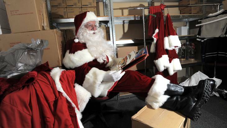 Part-time Santa at Westfield Belconnen, John Rundle, relaxes between shifts in a back room. Photo: Graham Tidy