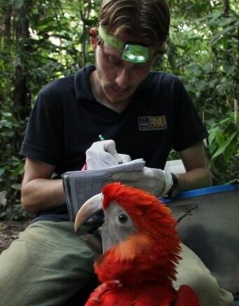 George Olah and macaw on the Peruvian Amazon.
