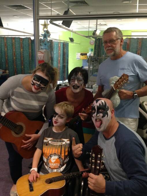 Jack Woodhams with parents Paul and Karyn Woodhams and his grandparents during a music therapy session with music therapist Matt Ralph, at Sydney Children's Hospital, Randwick. Photo: Supplied
