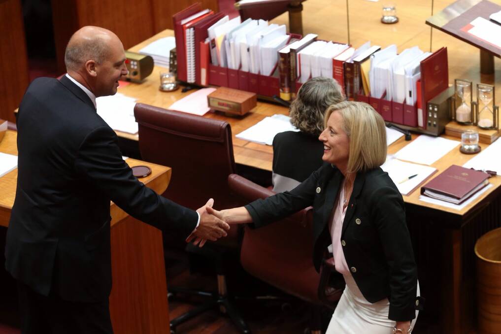 Katy Gallagher is congratulated by Senate president Senator Stephen Parry at Parliament House in Canberra on Thursday. Photo: Andrew Meares