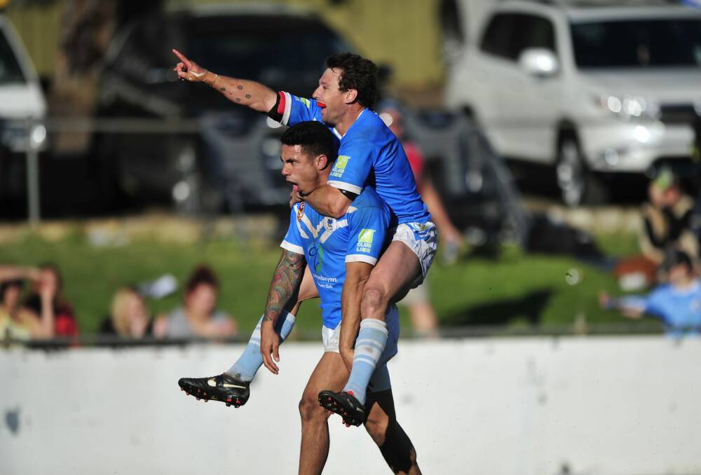 Queanbeyan Blues players Tom Ruediger and Ben Nicoll celebrate a try in last year's grand final win over Goulburn.   Photo: Melissa Adams 