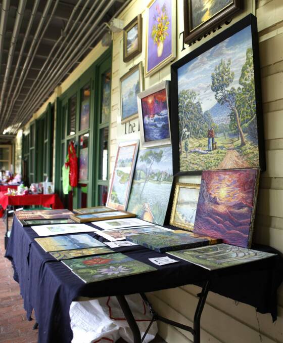 Paintings on sale at the markets in 2012. Photo: Katherine Griffiths