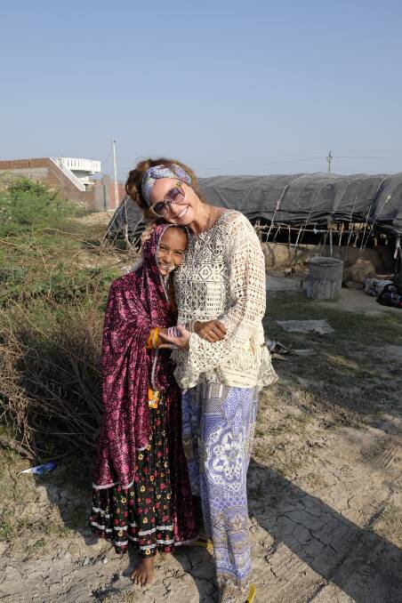 Fashion designer and burgeoning philanthropist Camilla Franks with her friend Jenu on tour in India.  Photo: Supplied
