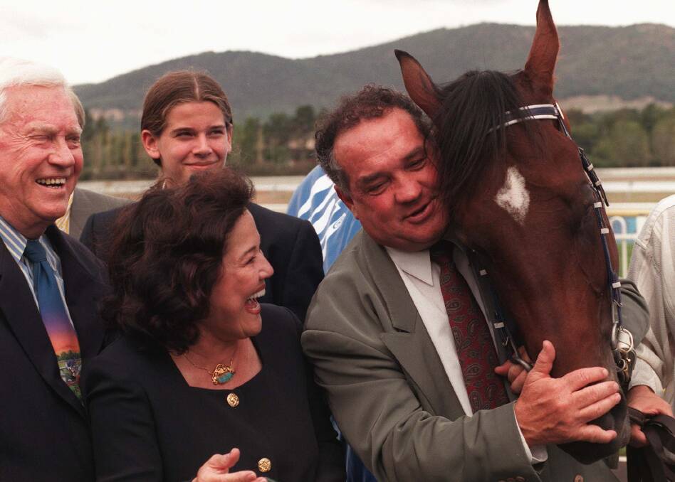 Queanbeyan trainer Frank Cleary gives Catbird a hug after winning the '99 Black Opal.