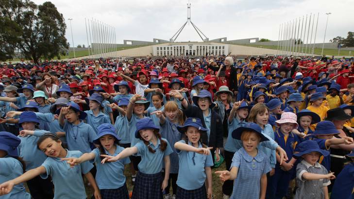 Students sing at the 'Music: Count Us In' event on the front lawn of Parliament House yesterday. Photo: Alex Ellinghausen