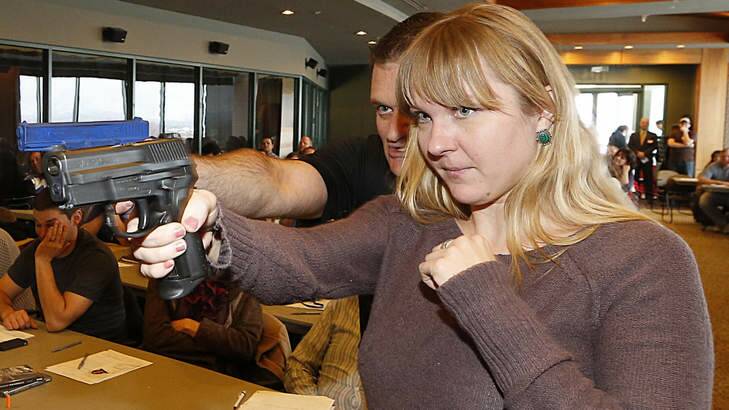 A primary school teacher  in Utah gets free firearms training courtesy of the Utah Shooting Sports Council on Thursday. The firearms death rate in the US is six times higher than in Australia.