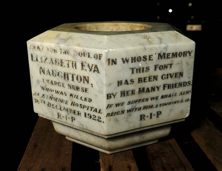 A 90-year-old memorial stone for nurse Naughton was discovered in a nondescript Holder alley. The stone is pictured at Mitchell emergency response centre. Photo: Stuart Walmsley