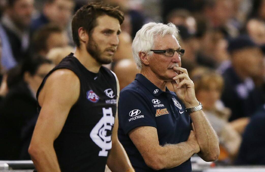 Dale Thomas and Blues coach Mick Malthouse look on during the game. Photo: Getty Images