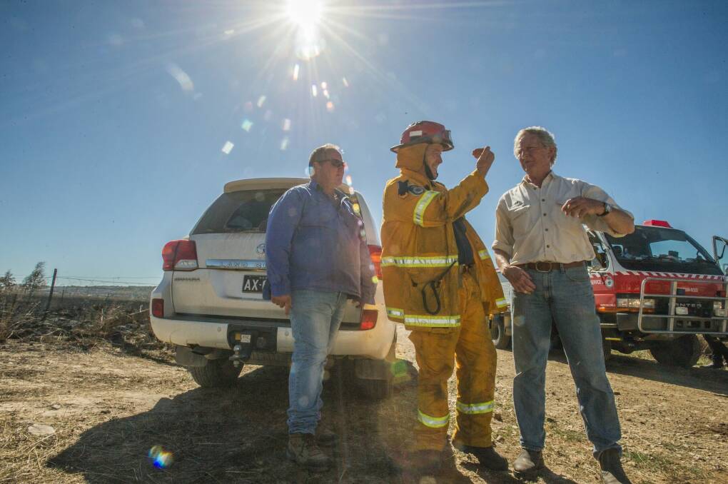 Mulloon Creek Natural Farms owners Tony Coote, Gary Nairn and Michael Fitzgerald assess the damage to their property. Photo: Karleen Minney