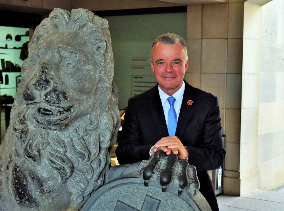 AWM director Dr Brendan Nelson with one of the Menin Gate lions. Photo: David Ellery