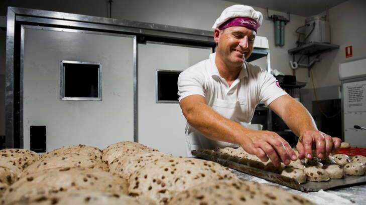 Belconnen Baker's Delight owner Chris Smith prepares chocolate hot cross buns for rising. Photo: Rohan Thomson