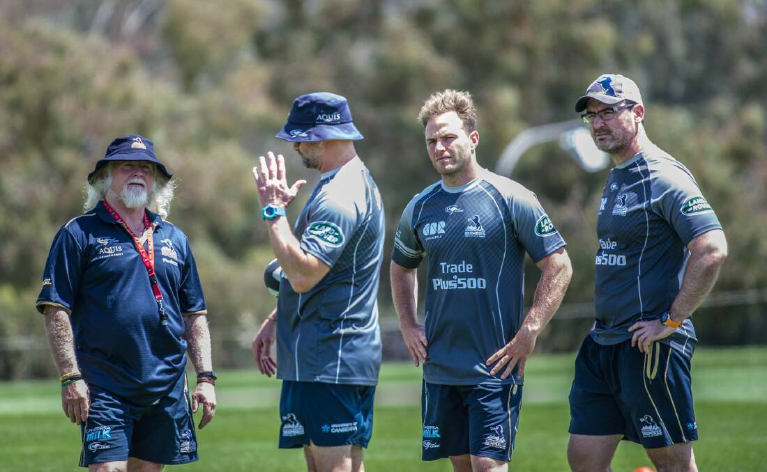 Peter Ryan, centre, with the Brumbies coaching staff. Photo: Karleen Minney