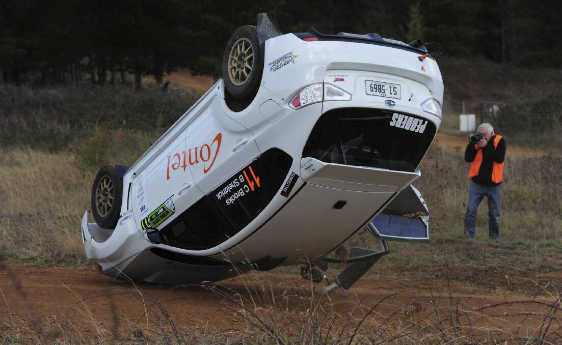A passenger got more than expected with a rollover on the last corner of his hot-lap. Photo: Graham Tidy