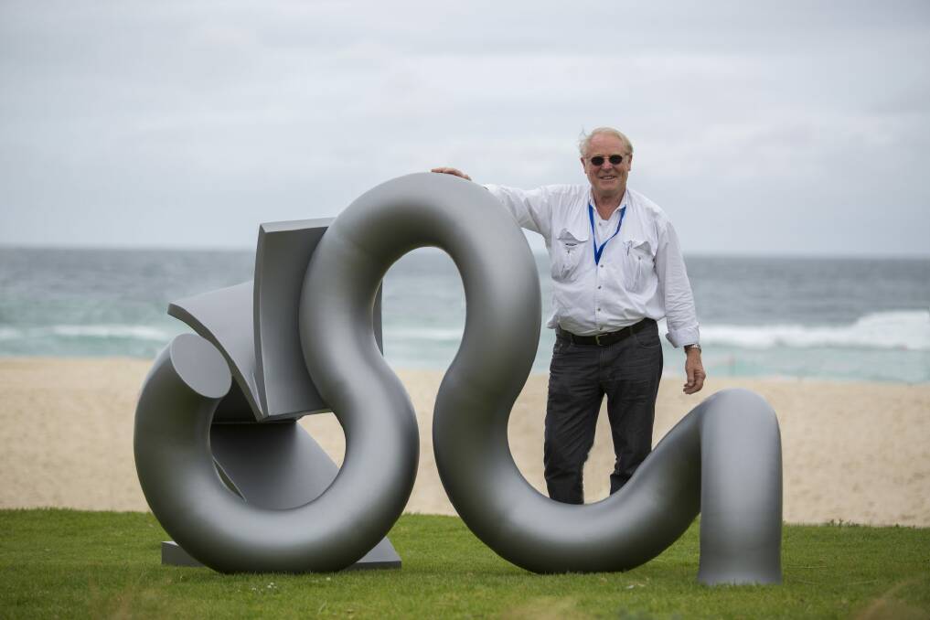 Canberra artist Michael Le Grand has been named the sole recipient of the Artistic Excellence Program 2015. He is pictured here with his sculpture Recoil which is being displayed at Sculpture by the Sea in Bondi. Photo: Gareth Carr