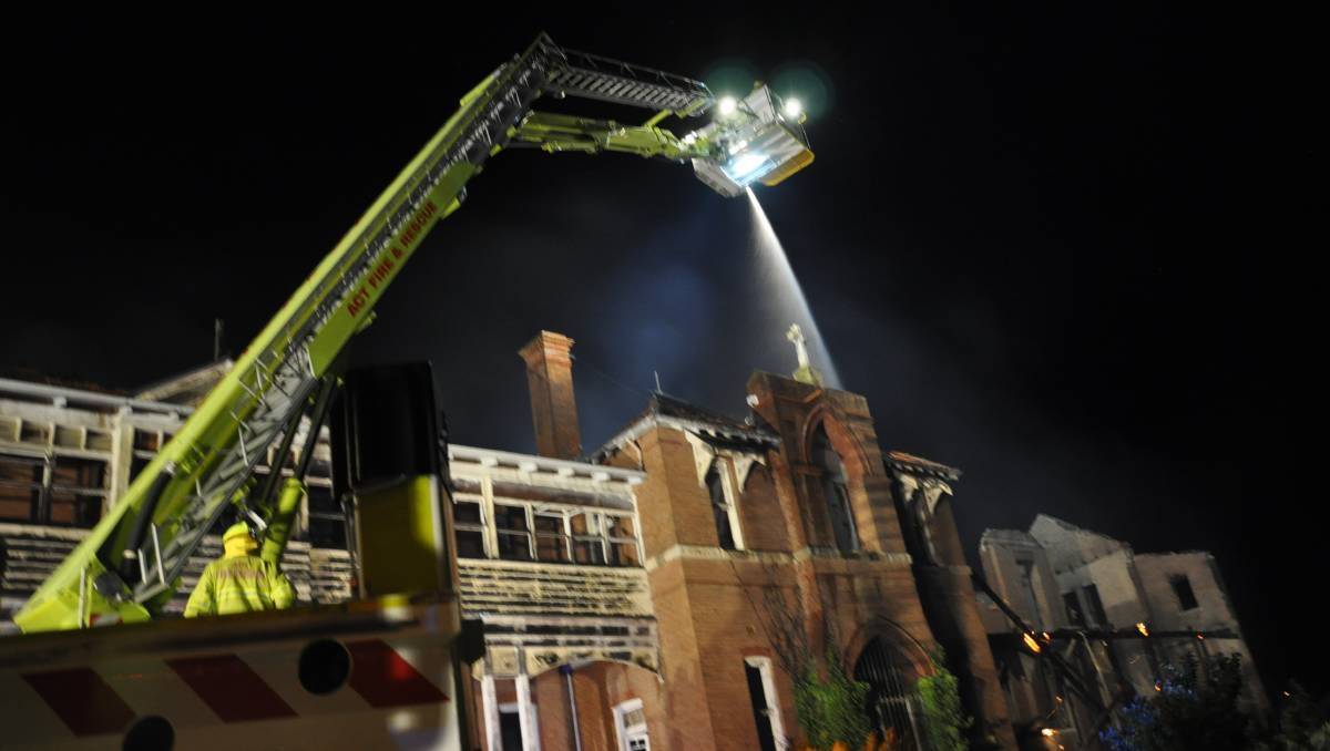 An ACT Fire and Rescue 'Bronto' truck helps douse a fire at the Goulburn orphanage. Photo: Louise Thrower