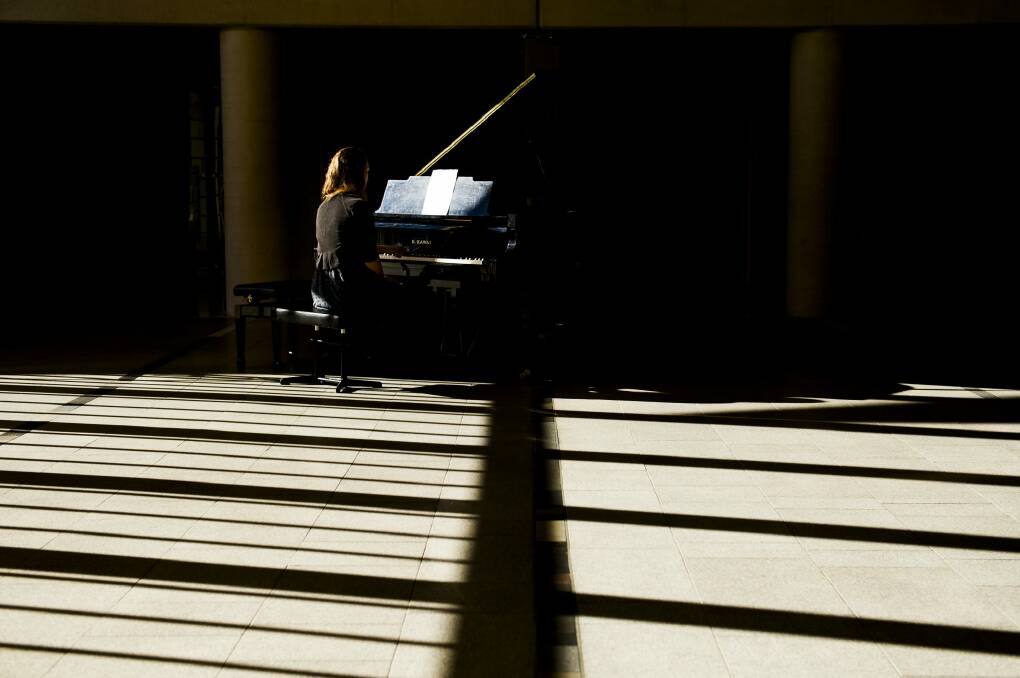 Emily Buckley and musicians from the Australian National University (ANU) School of Music spent six hours performing a composition by French composer Erik Satie at the National Portrait Gallery.
 Photo: Jay Cronan 