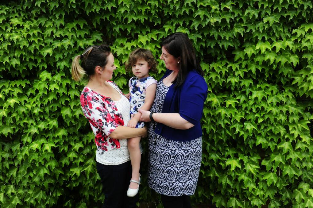 Jocelyn Williams with her daughter, Elke, 3 and Jocelyn's sister-in-law Alex Conroy. The family are raising awareness of bowel cancer, which took the life of their husband, father and brother. Photo: Melissa Adams