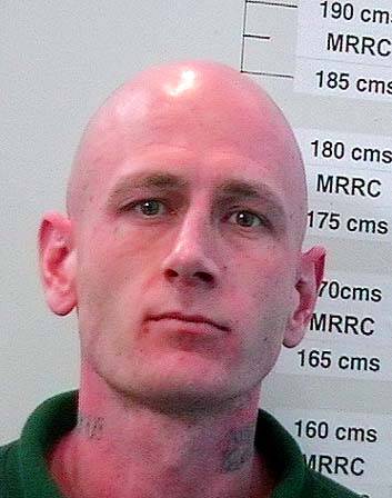 Wanted ... Adam John Bowhay, 34. Photo: Police Media