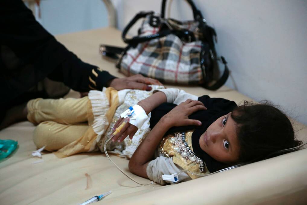 A girl is treated for a suspected cholera infection at a hospital in Sanaa, Yemen. Photo: AP