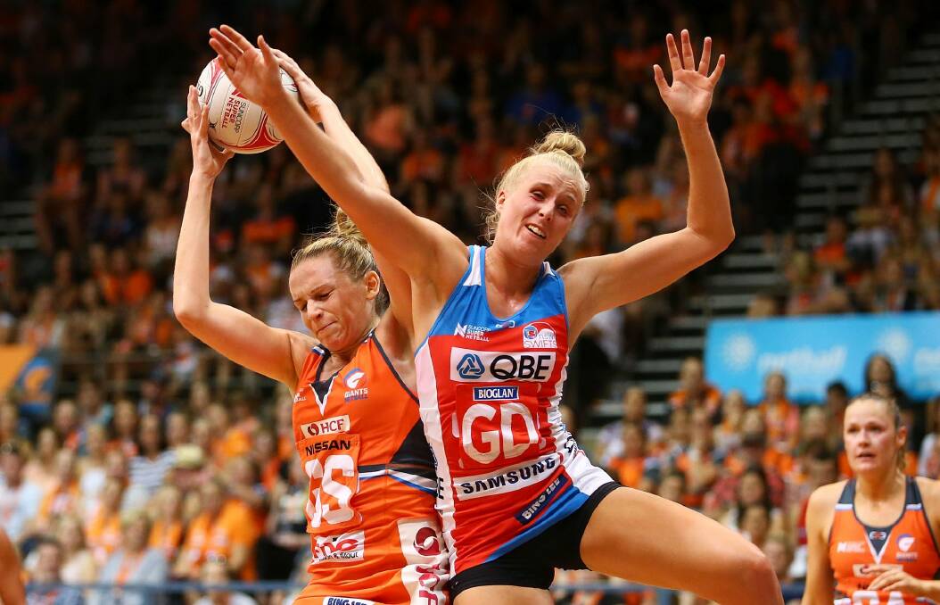 Super start: Jo Harten of the Giants and Maddy Turner of the Swifts contest possession. Photo: Getty Images