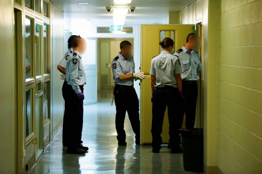 News 
 ACT police officers of the City Police watch house deal with in an influx of intoxicated people 
The Canberra Times  
Date:  29 November 2014
Photo Jay Cronan