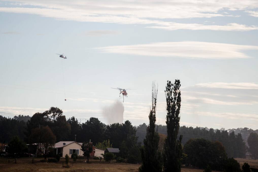 Eight aircraft were involved in holding the fire east of Sutton Road Photo: Jamila Toderas