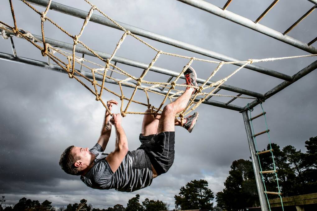 Caden Helmers tried the Ninja Warrior course under the guidance of Canberra's own ninja warrior Lee Campbell.  Photo: Sitthixay Ditthavong