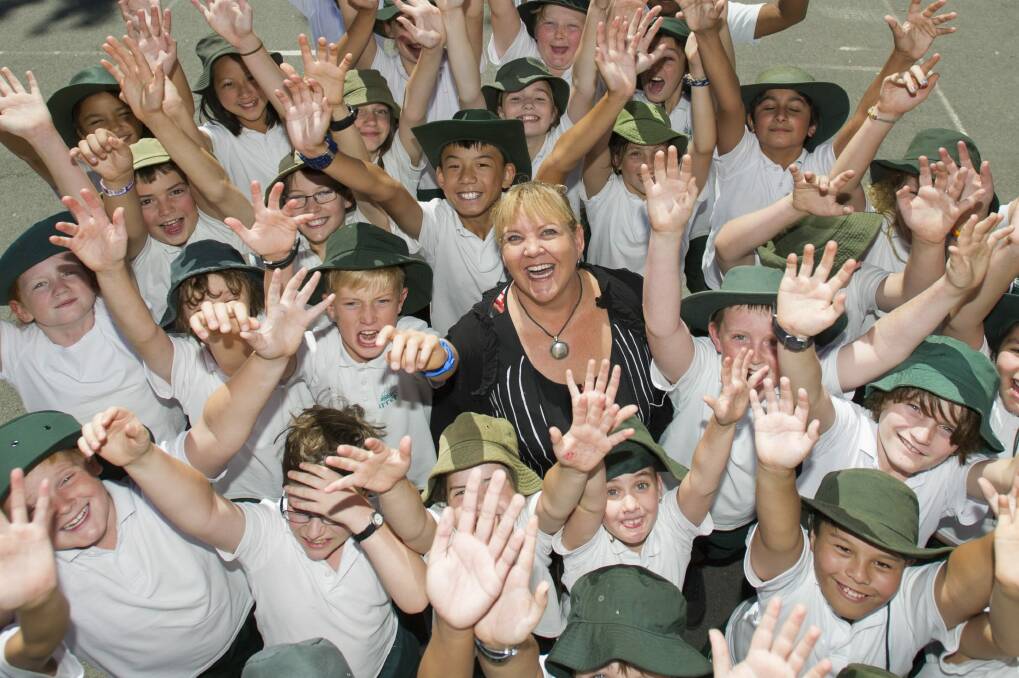 Acting Farrer primary principal Linda Heath with students celebrating the school's jump in the NAPLAN tables. Photo: Jay Cronan