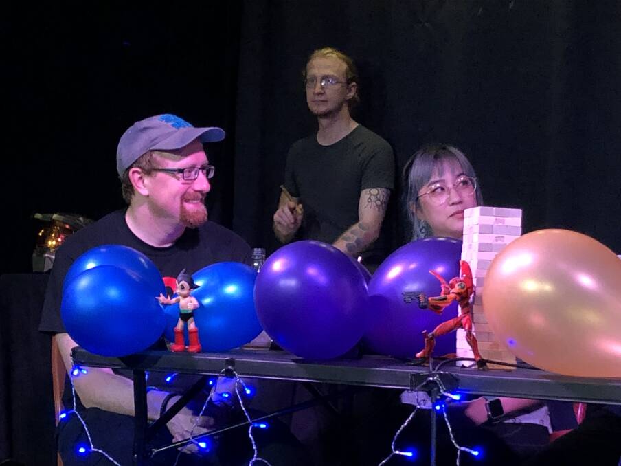 From left, Euan Bowen (player and former Master of Dungeons), Jack Collins (bard), Helen Luan (player) at <i>Roll for Intelligence</i>. Photo: Leon Garvin